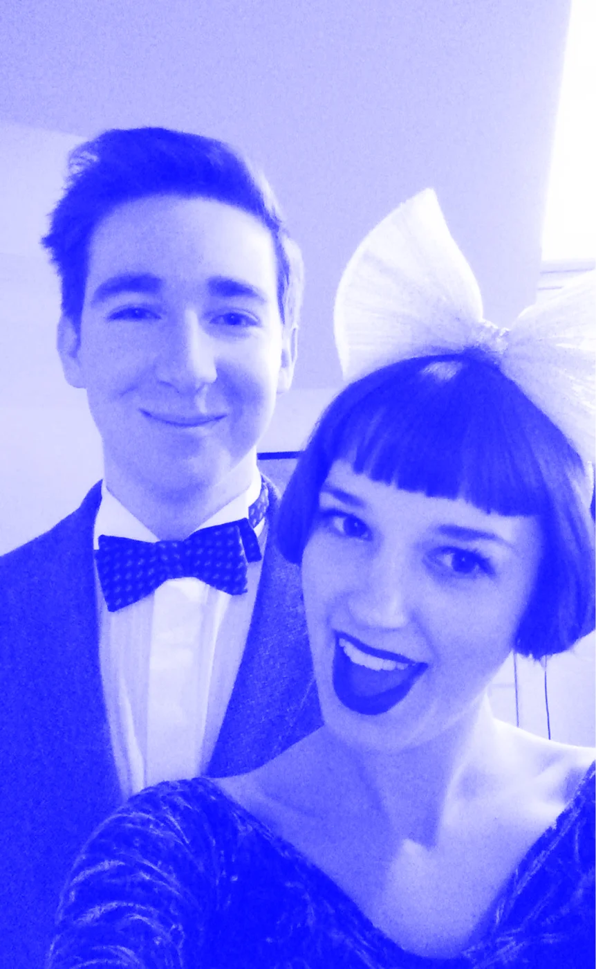 Patrick at Jess on new years, he's wearing a bow tie and she has a big bow in her hair.